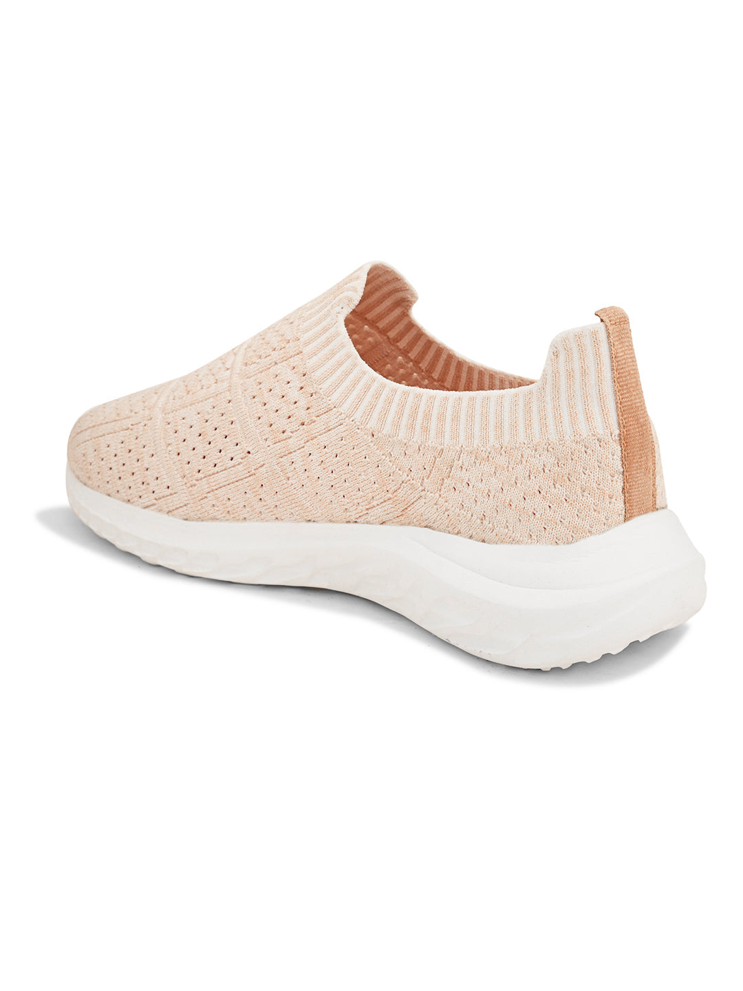 Peach slip-on sneaker with a breathable knitted upper, perforated design for ventilation, and a cushioned white sole for comfort and flexibility.