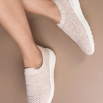 Peach Slip-On Lightweight Women Shoes with a breathable knitted upper, perforated design for ventilation, and a cushioned white sole for comfort and flexibility.
