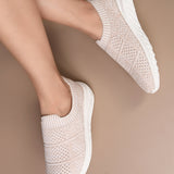 Peach Slip-On Lightweight Women Shoes with a breathable knitted upper, perforated design for ventilation, and a cushioned white sole for comfort and flexibility.
