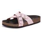 Pink slip-on flats, showcasing its design and material details.
