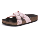 Pink slip-on flats, showcasing its design and material details.