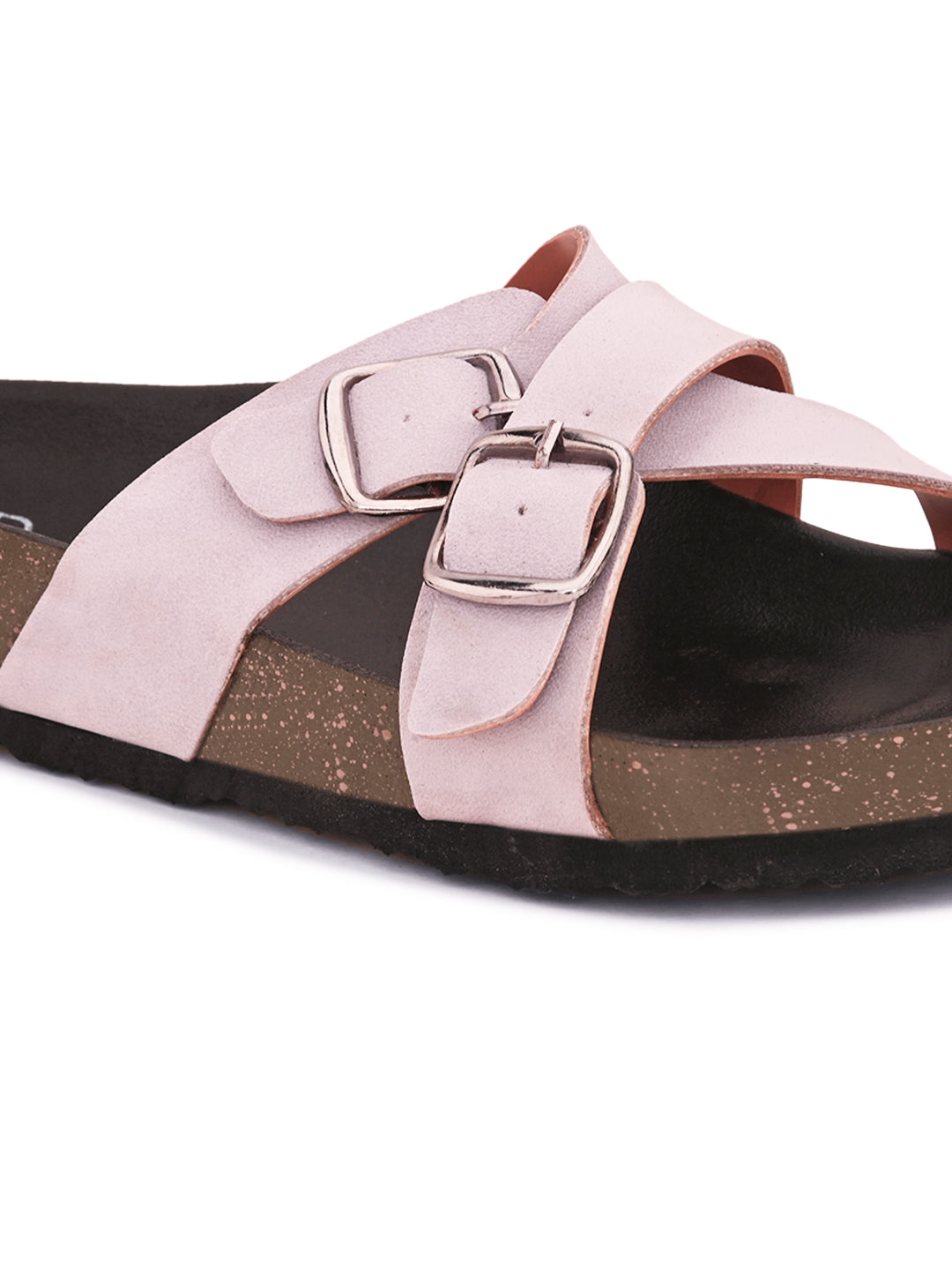 Pink slip-on flats, showcasing its design and material details.
