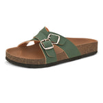Green slip-on flats, showcasing its design and material details.