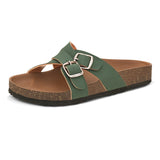 Green slip-on flats, showcasing its design and material details.