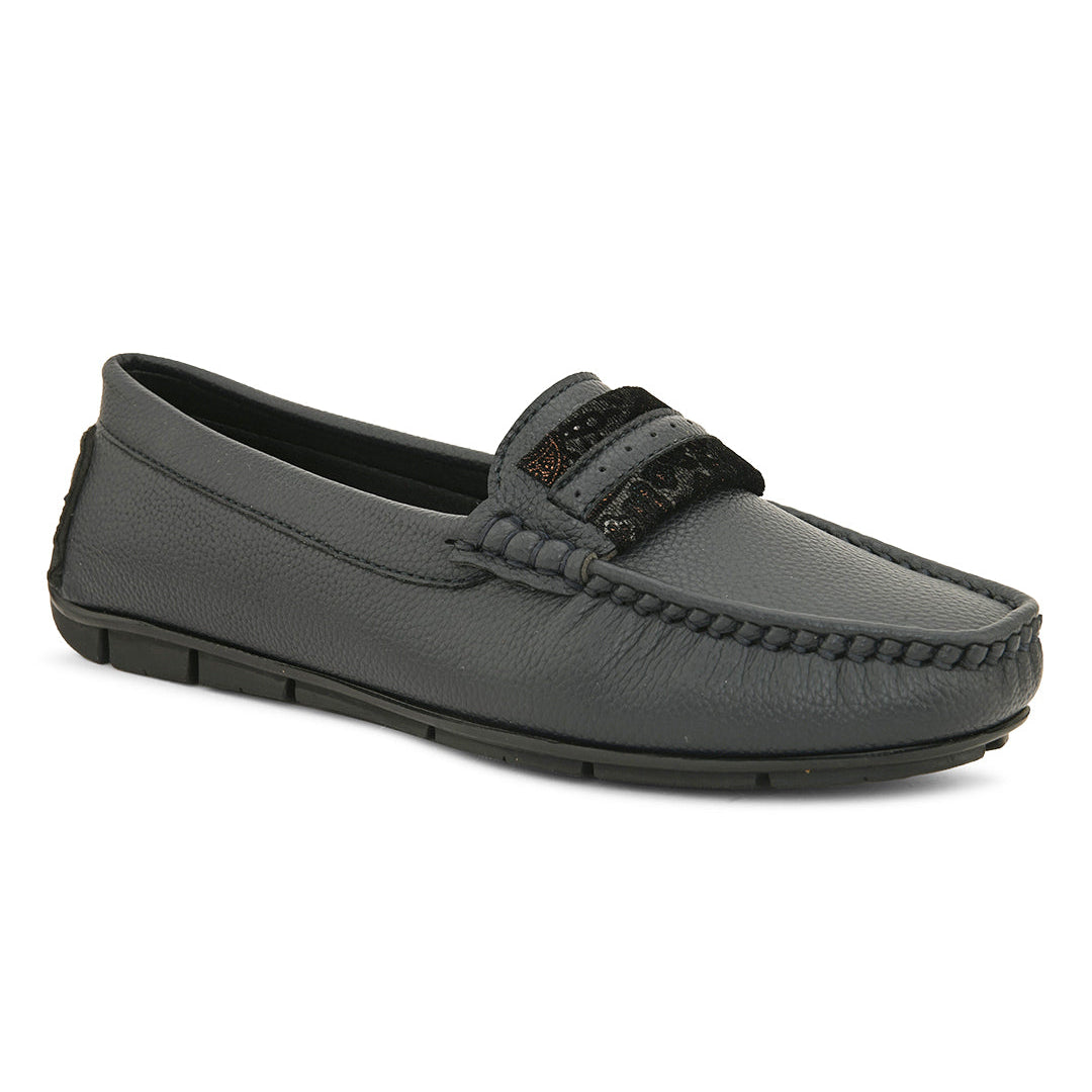 A single dark gray leather loafer with a textured sole and decorative strap across the front.