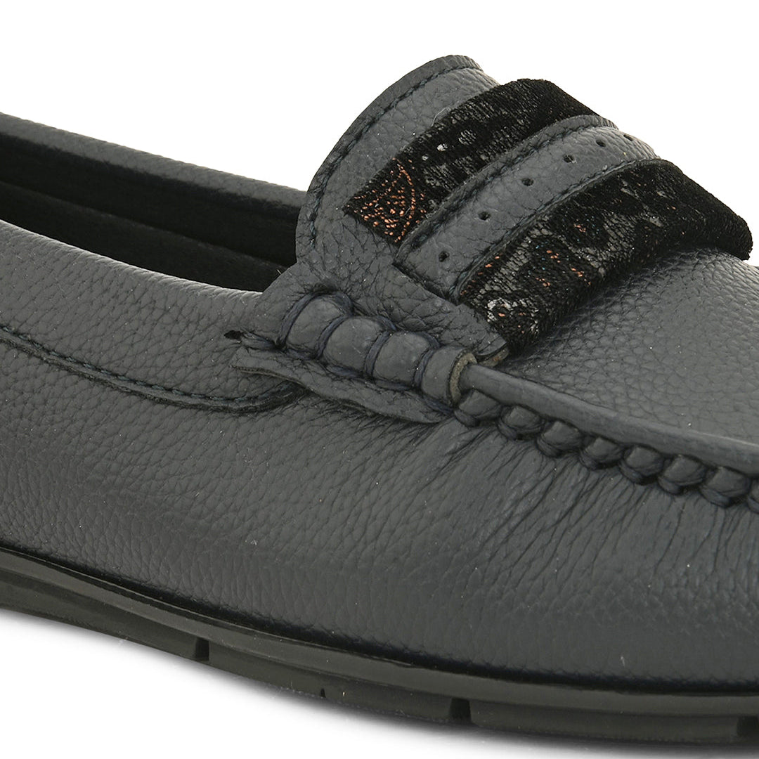 A single dark gray leather loafer with a textured sole and decorative strap across the front.