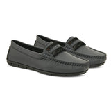 A single dark gray leather sleek loafer for women with a textured sole and decorative strap across the front.
