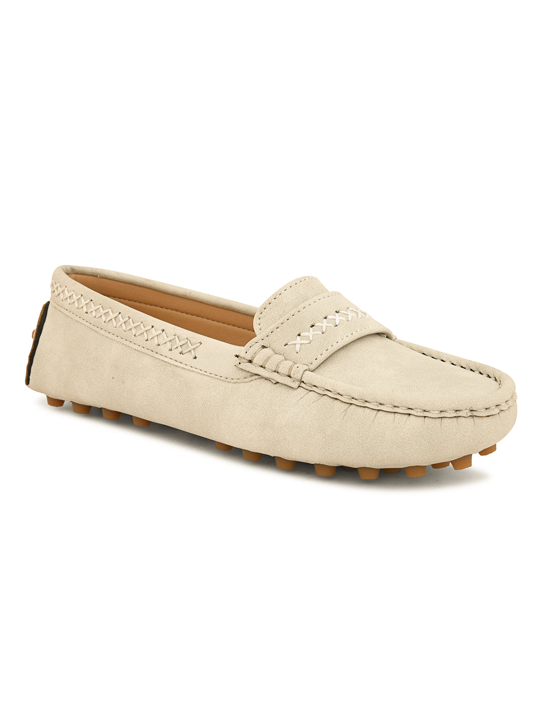 Beige suede driving loafer with stitched details, cross-stitched vamp band, and studded rubber sole.
