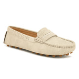 Beige suede driving loafer with stitched details, cross-stitched vamp band, and studded rubber sole.