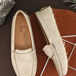 Women’s Lightweight Round Toe Loafers in beige suede with stitched details, cross-stitched vamp band, and studded rubber sole.