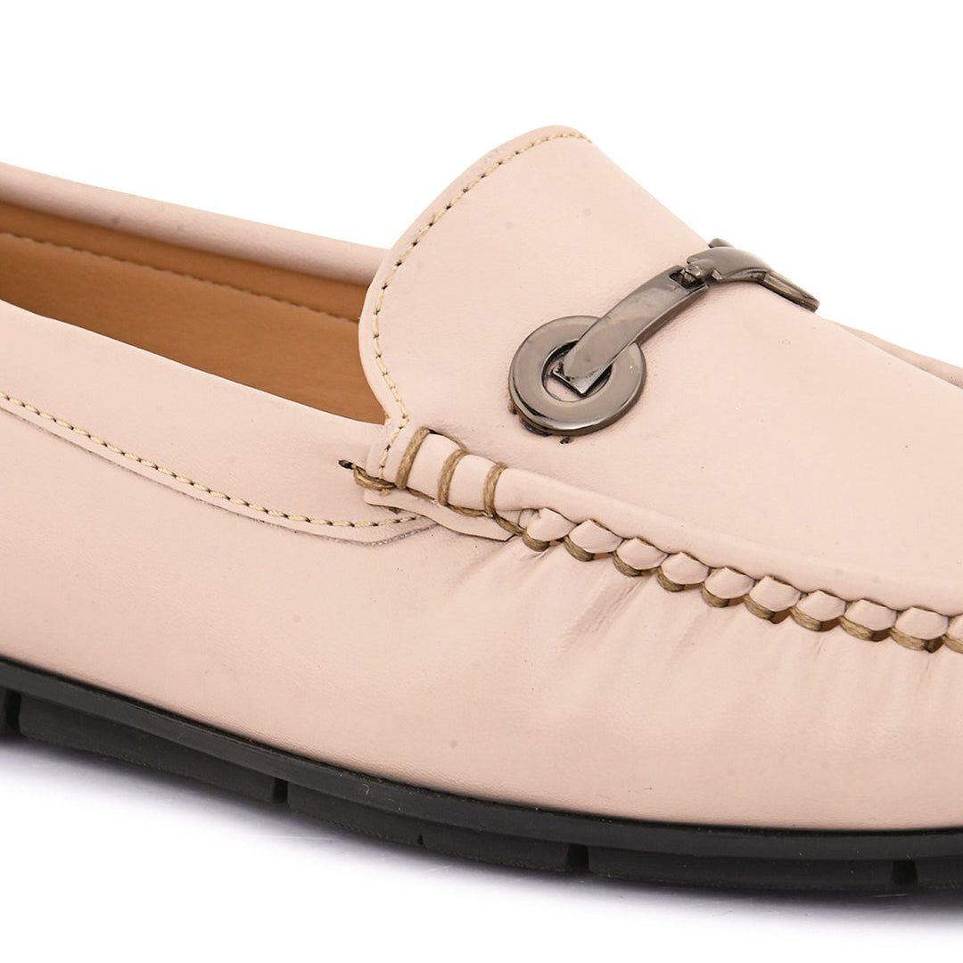 Beige leather loafer with black sole and silver buckle detail. add women's casual slip on loafers
